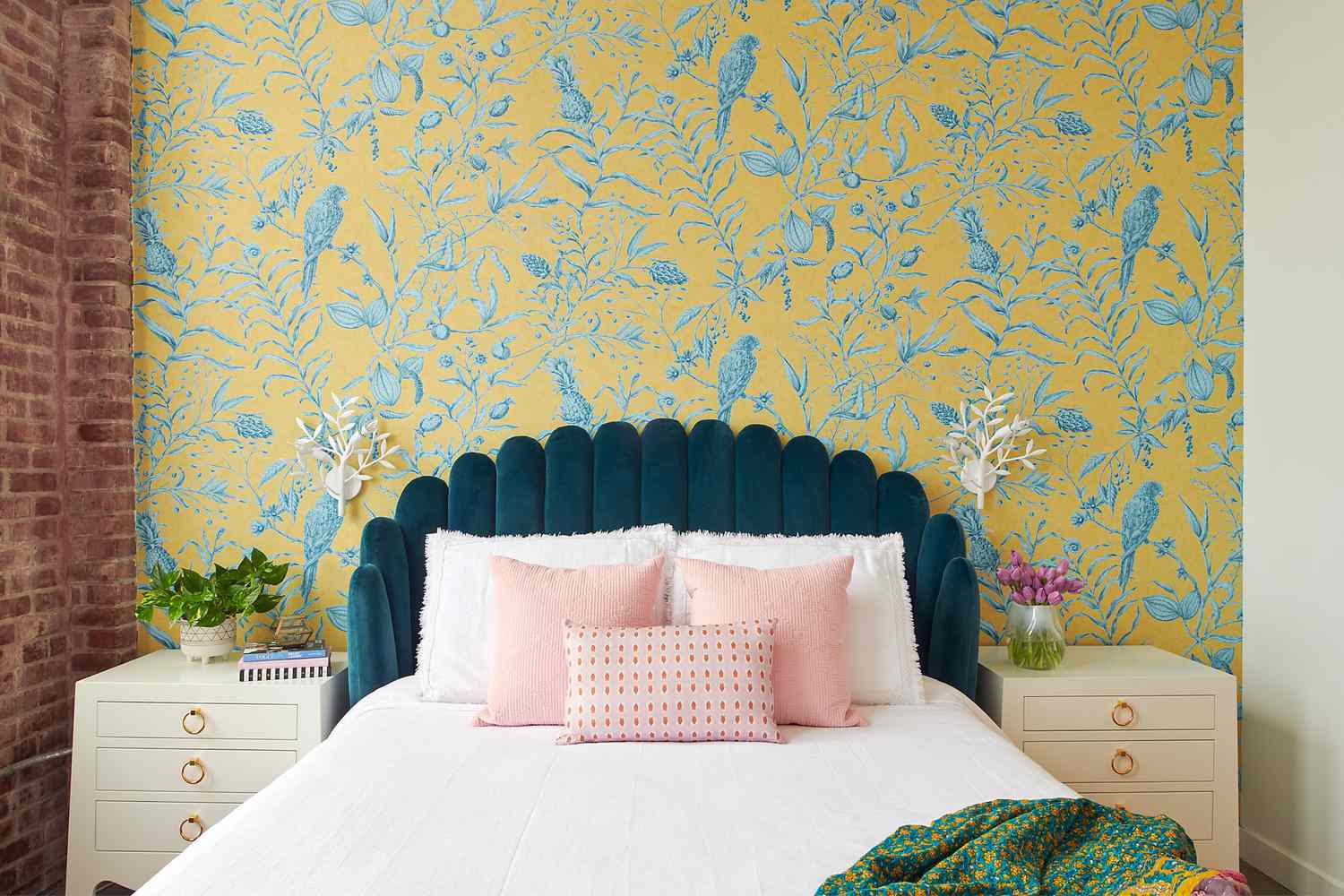 Gold patterned wallpaper in a refined bedroom